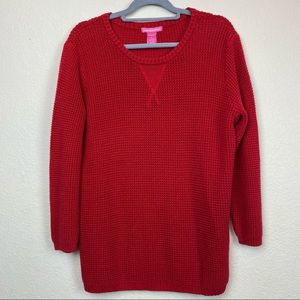 Woman within red waffle knit scoop neckline sweate